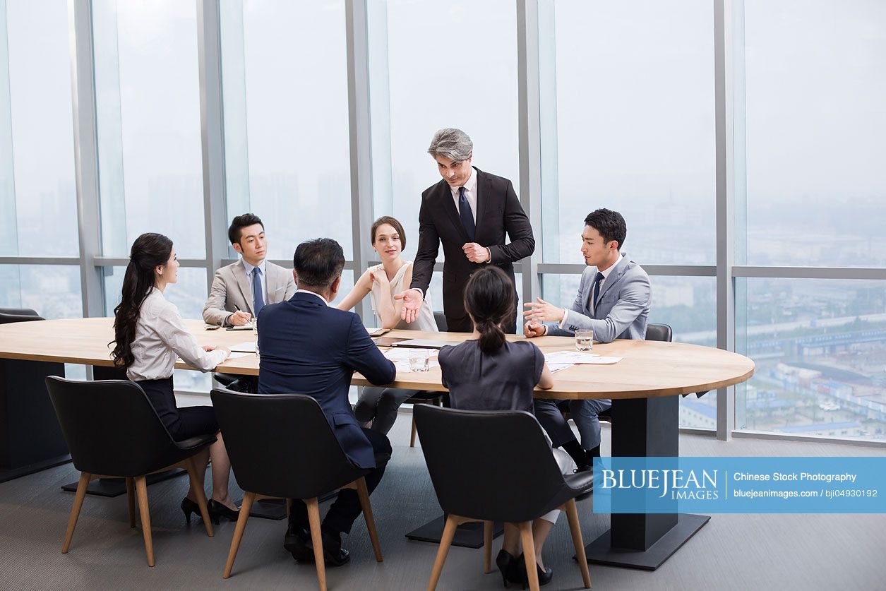 Business people having meeting in board room