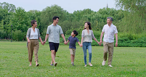 Happy Chinese family walking on grass,4K