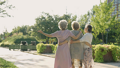 Happy senior Chinese friends relaxing in park,4K