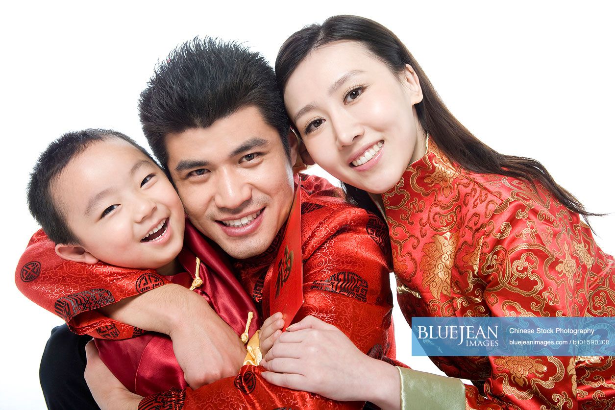 Family of three in Chinese traditional clothes