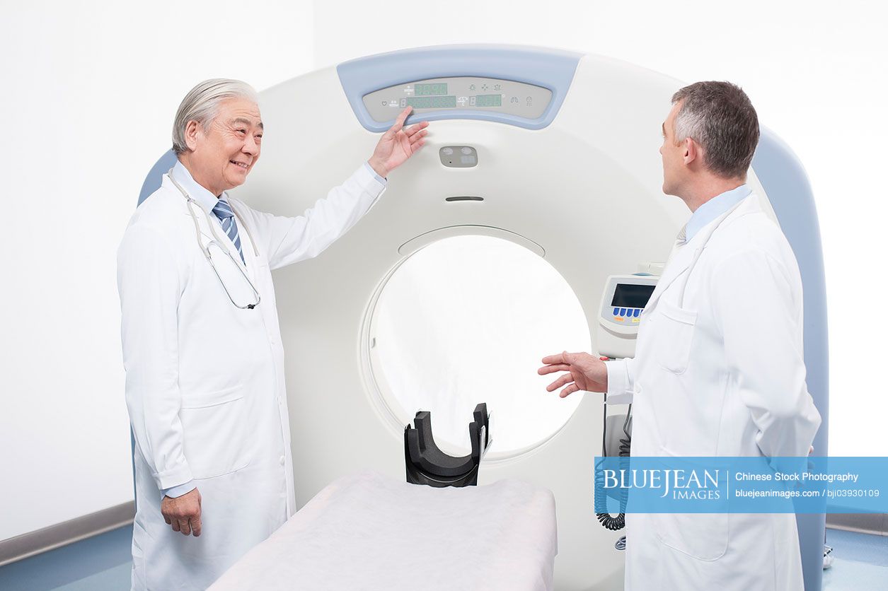 Doctors with MRI scanner