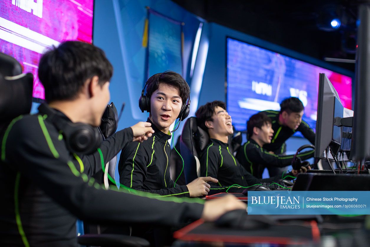 Young Chinese men playing esports