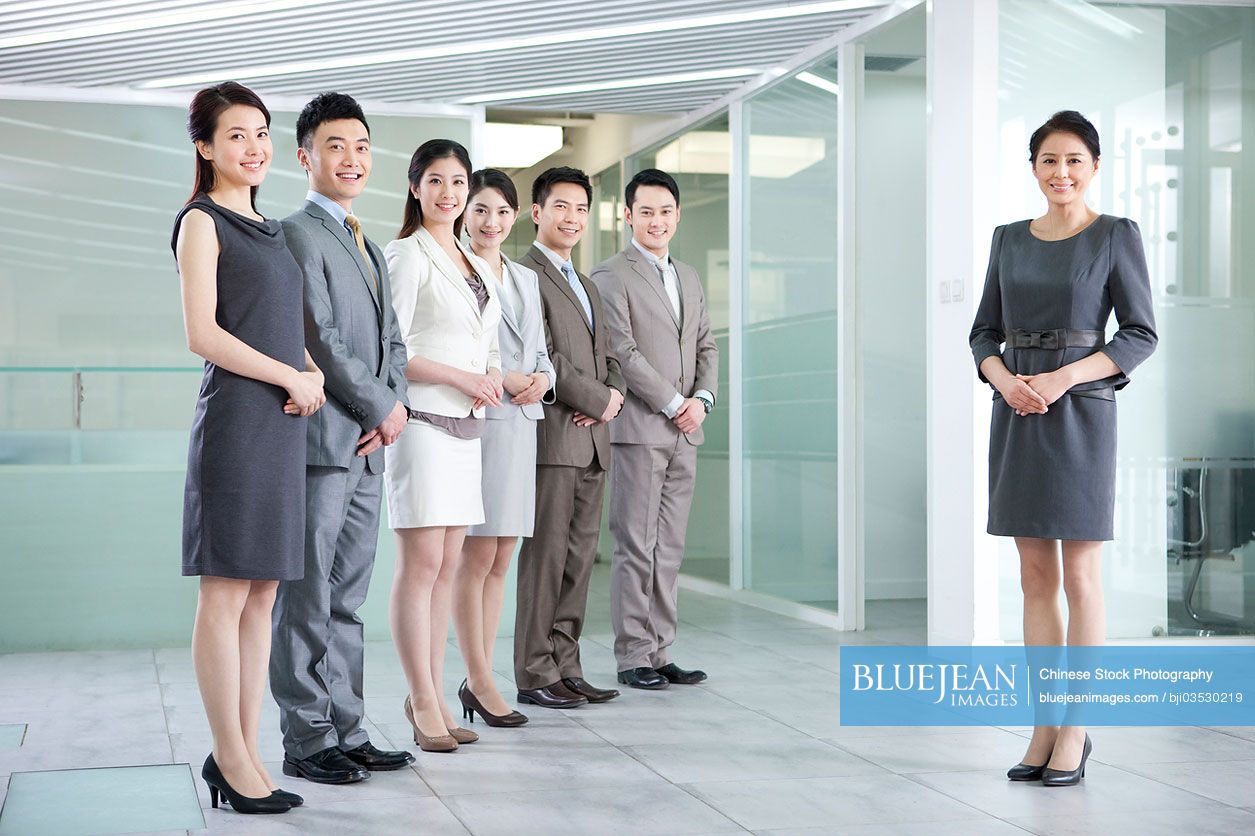 Portrait of happy Chinese business team