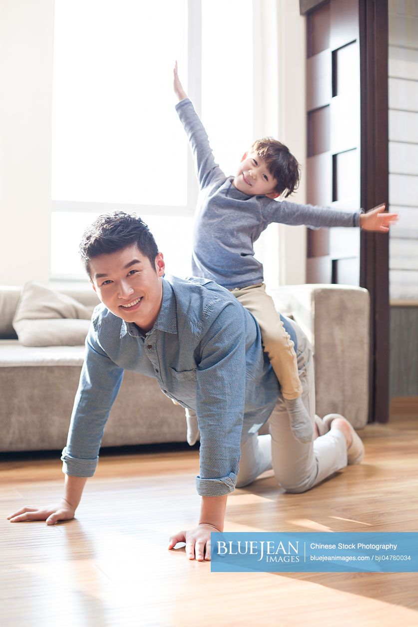 Happy young Chinese father and son