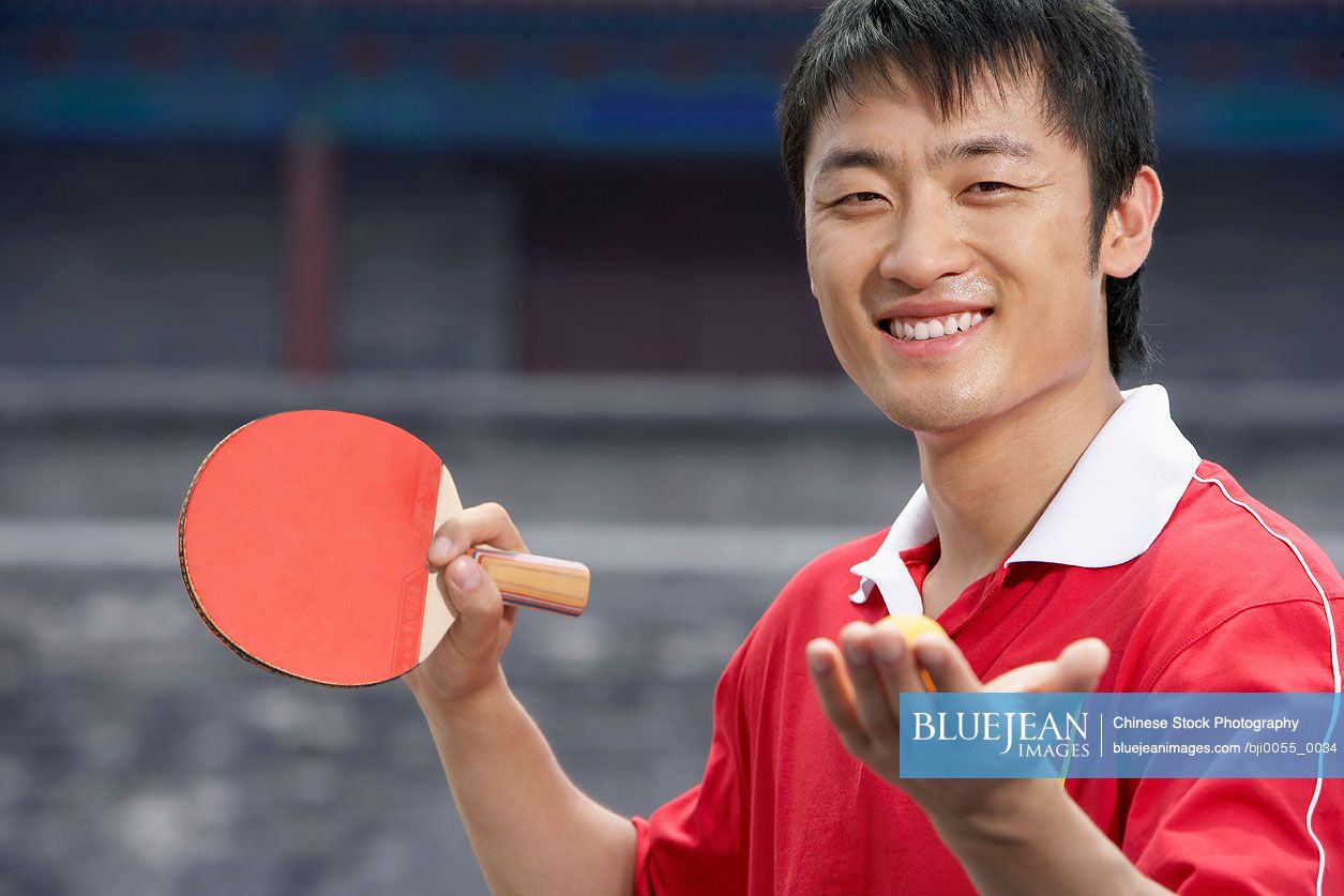 Of Chinese Ping Pong Player With Ball And Bat-High-res stock photo for download