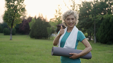 Happy senior Chinese woman exercising in park,4K