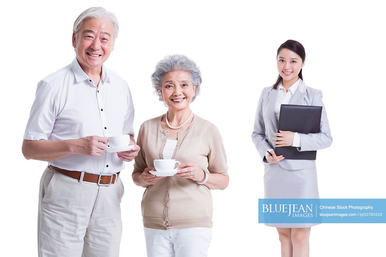 Senior Chinese couple with financial advisor