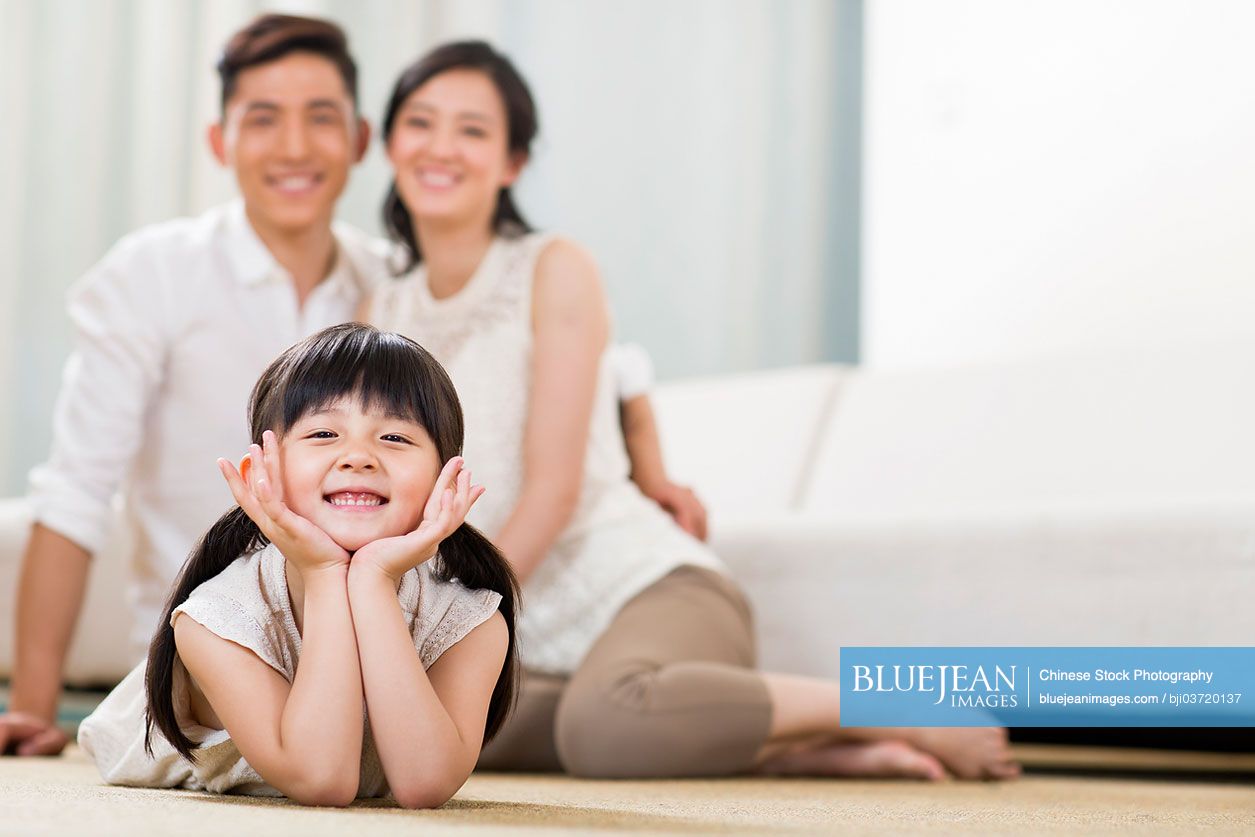 Happy Chinese family in living room