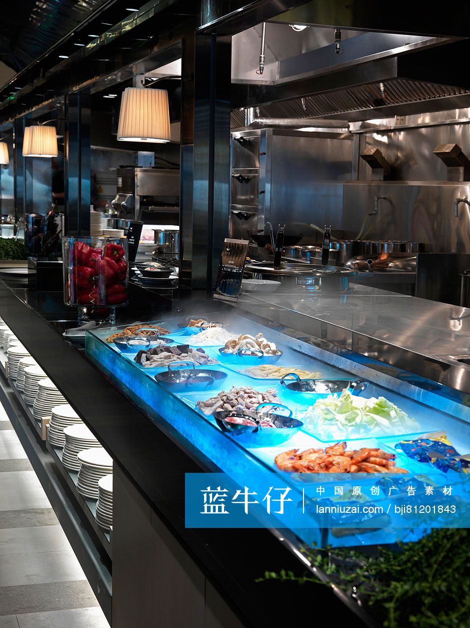 Commercial kitchen with variety of dishes in modern restaurant