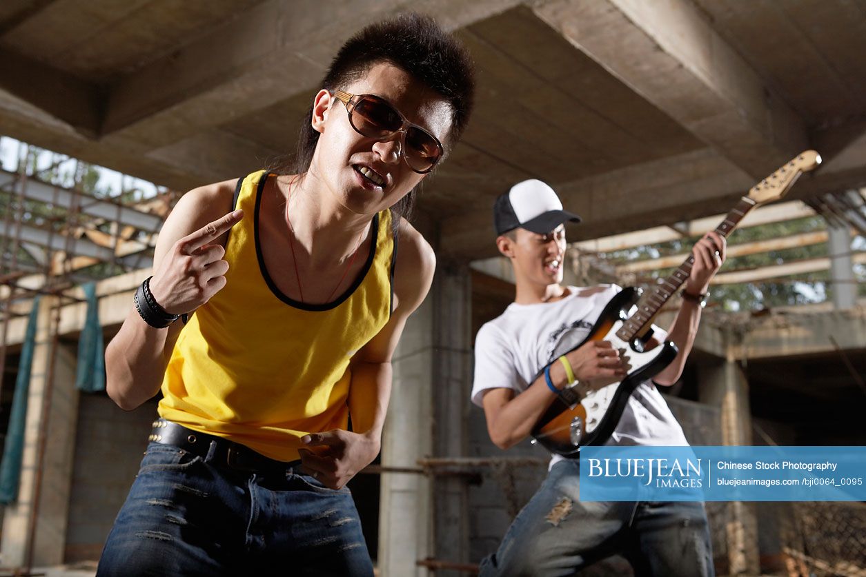 Young Chinese men playing rock music