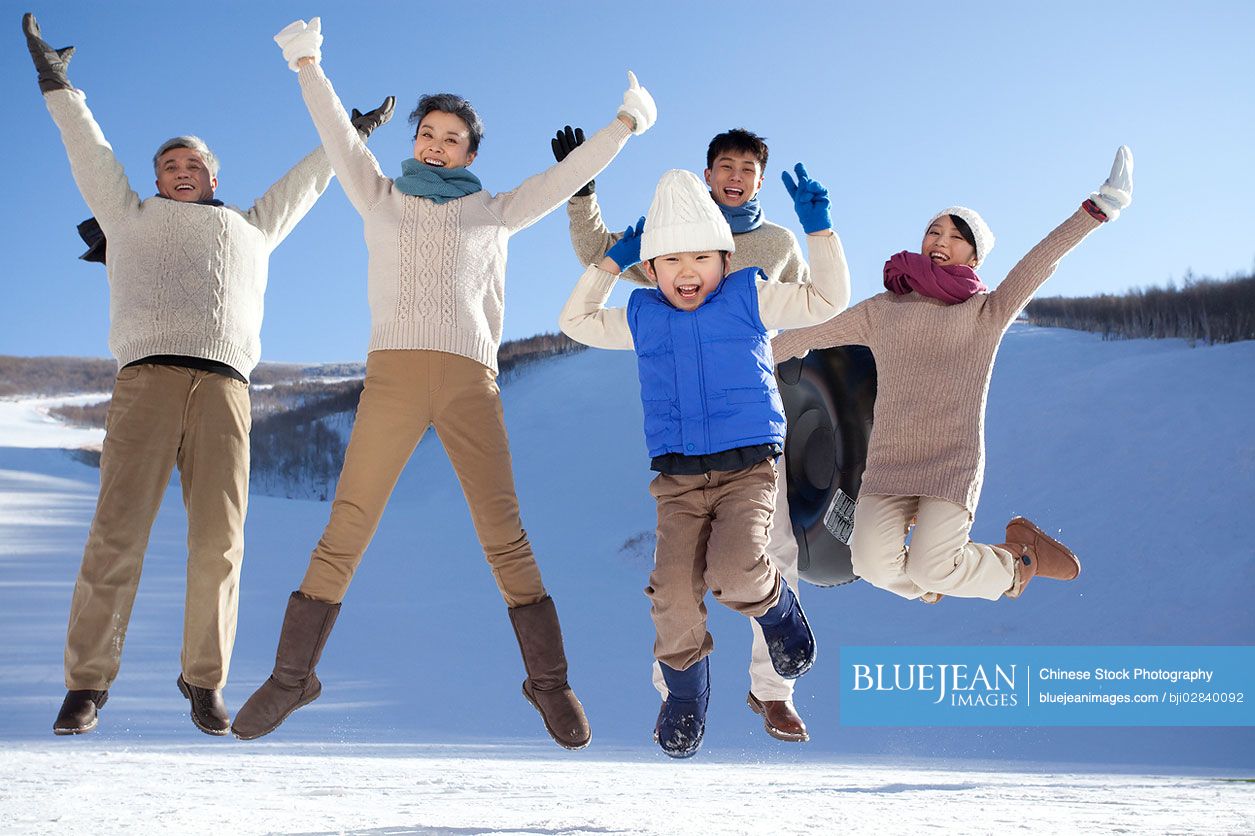 Chinese family having fun in snow