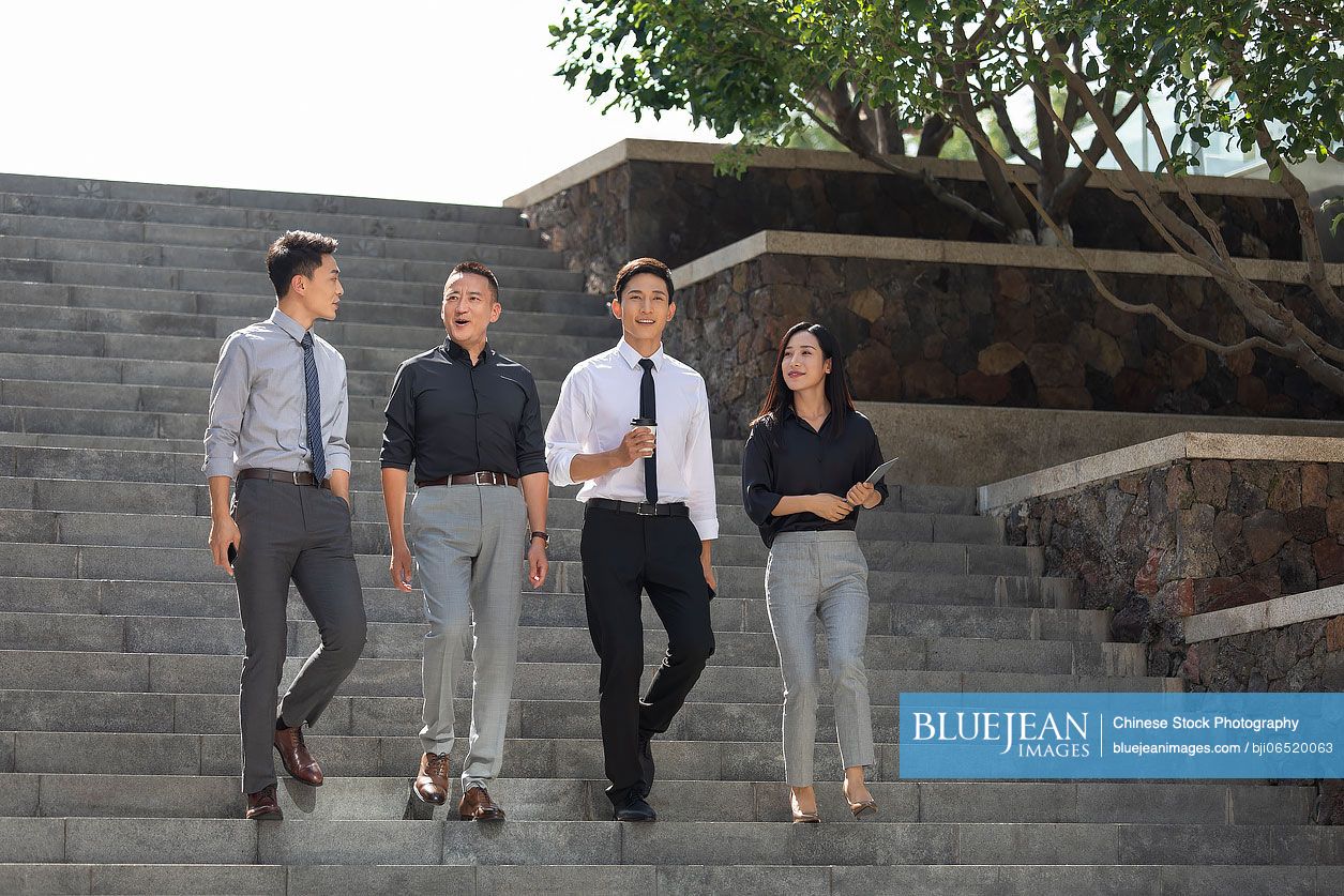 Chinese business people walking outdoors