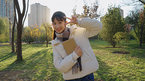 Cute Chinese college girl smiling