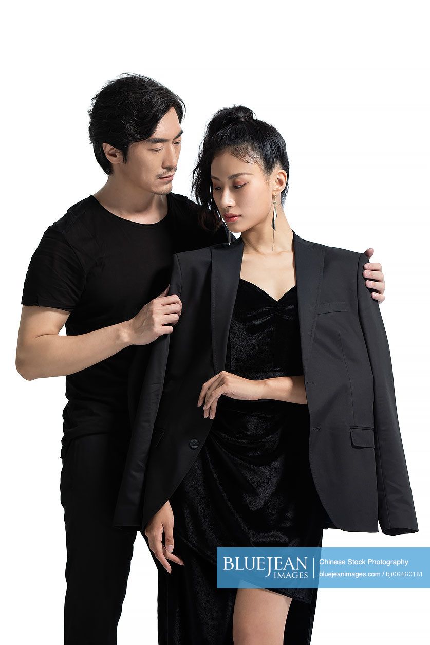 Studio shot of fashionable Chinese couple