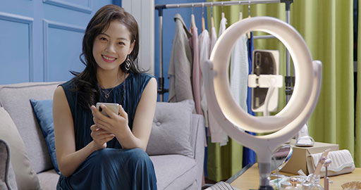 Female influencer live-streaming a product sale