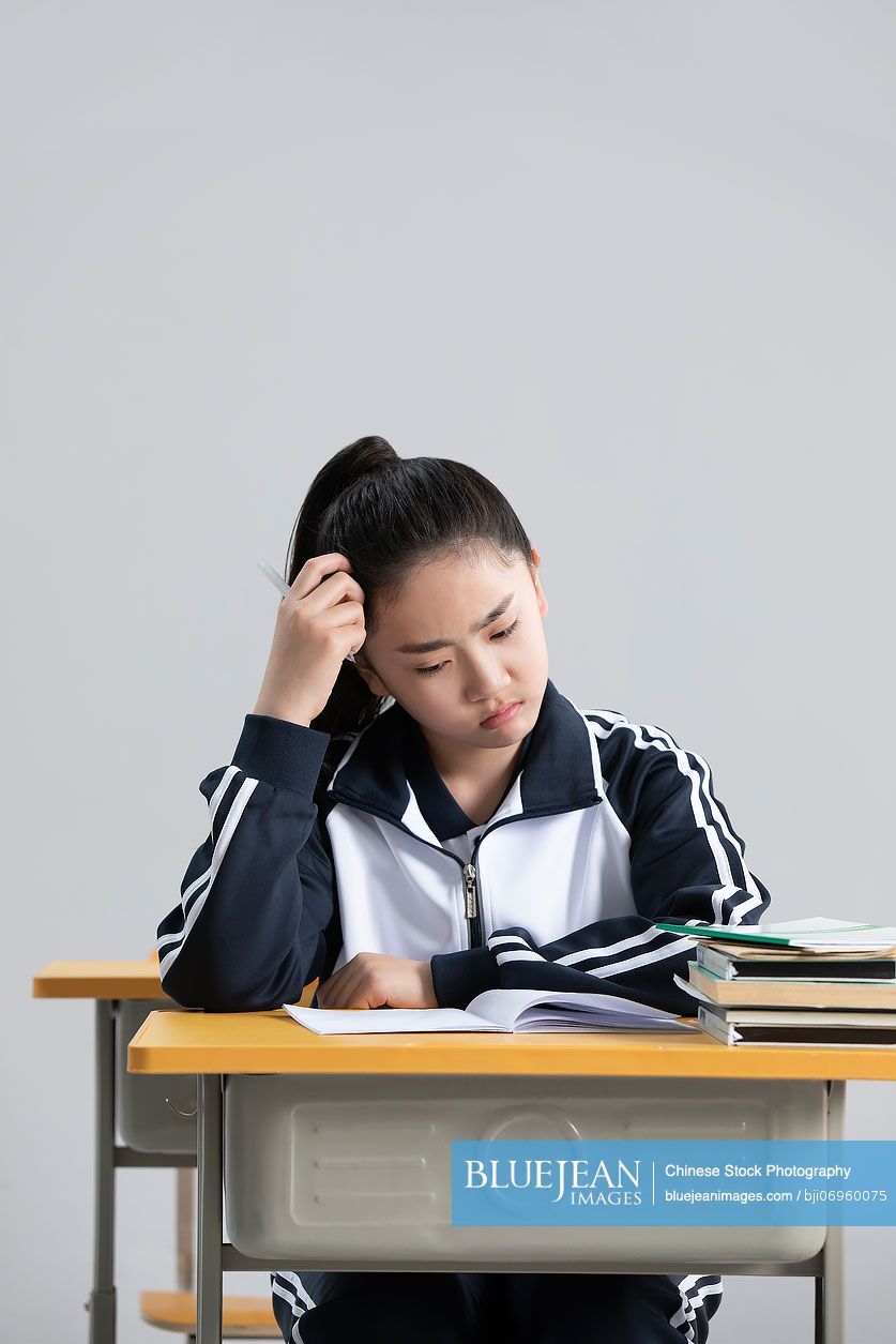 Chinese student thinking in classroom