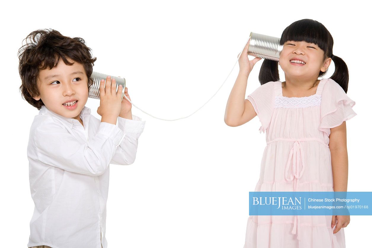Chinese kids playing with a tin-phone