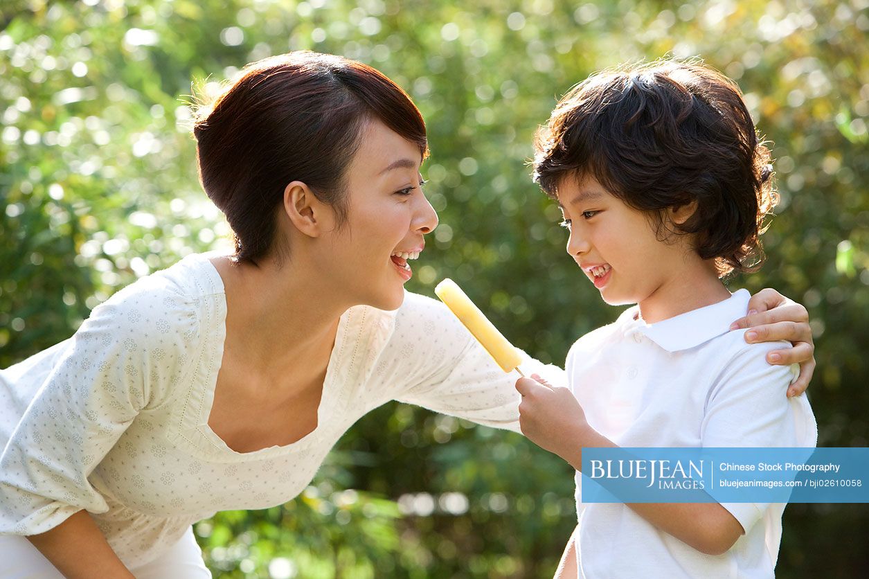 Tender moment between Chinese monther and son