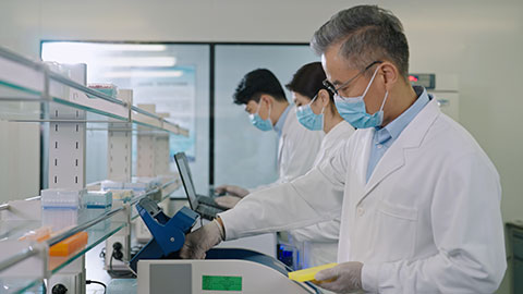 Chinese scientists examining medical sample in laboratory,4K