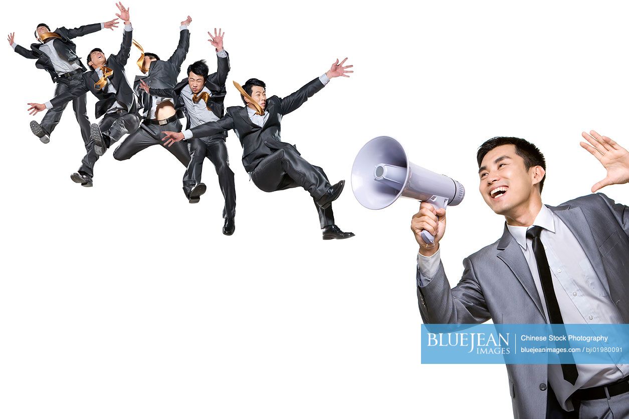 Chinese businessman blowing people away with megaphone