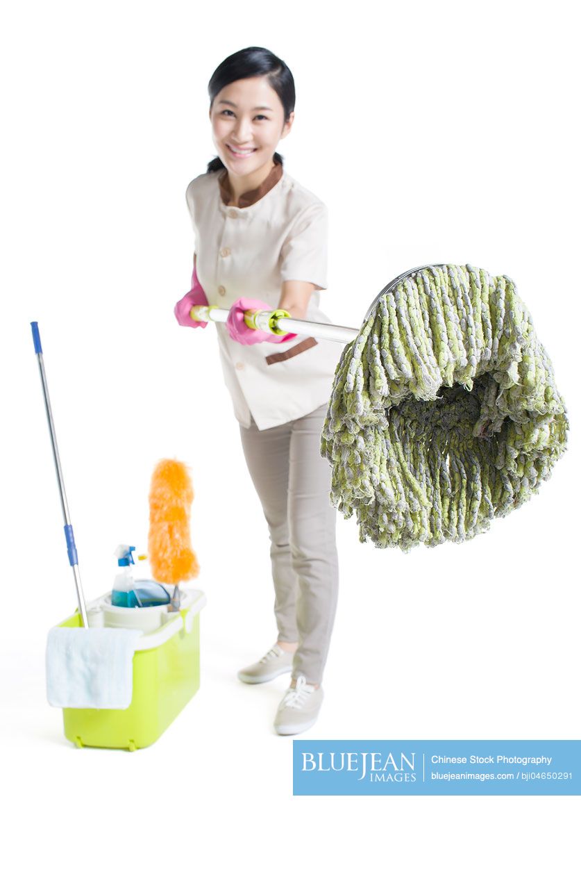 Chinese cleaner holding a mop-High-res stock photo for download