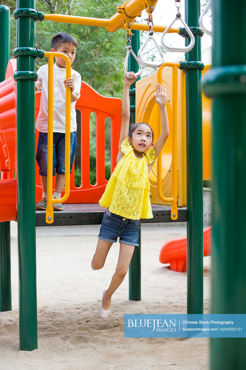 Happy Chinese children playing in park