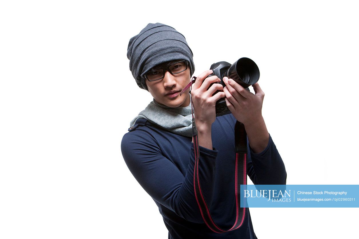 Cool young Chinese photographer with camera