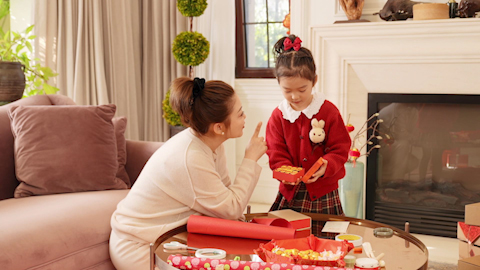 Family joyfully celebrating Chinese New Year together