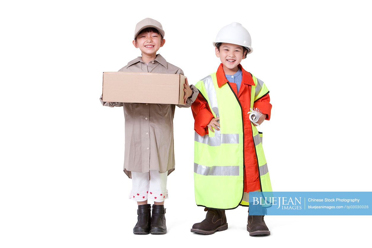 Chinese boy and girl dressing up like delivery person and engineer