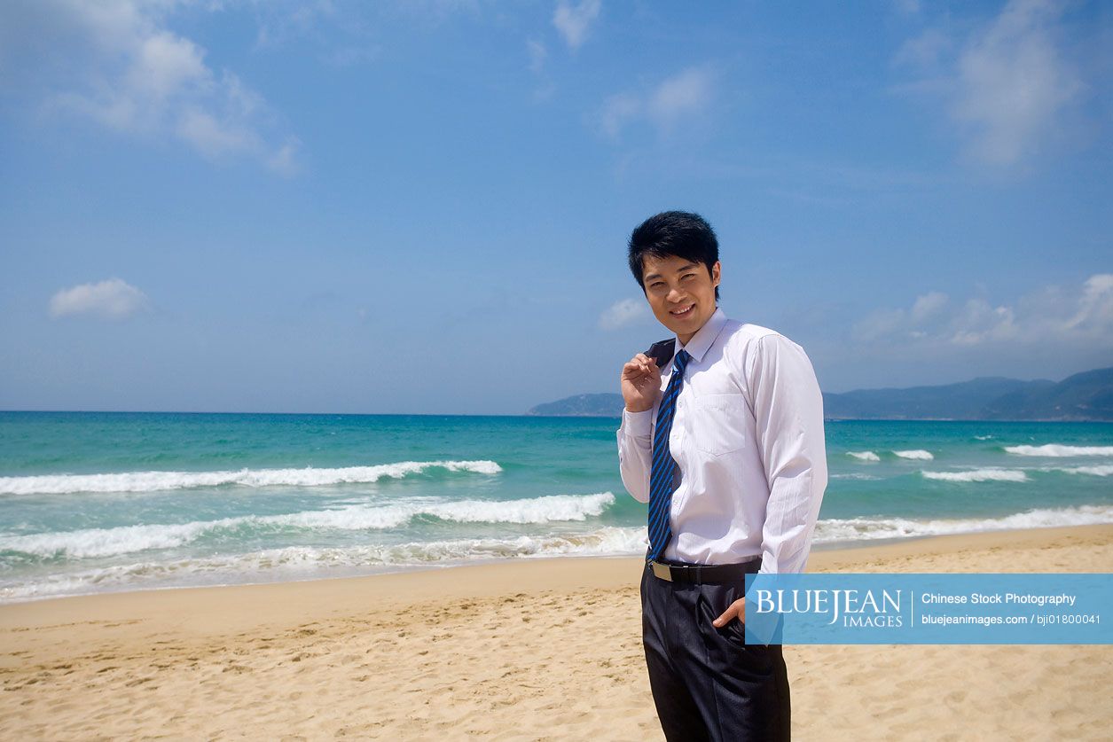 Portrait of a Chinese businessman on the beach