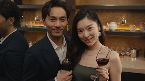Elegant young Chinese couple enjoying red wine,4K