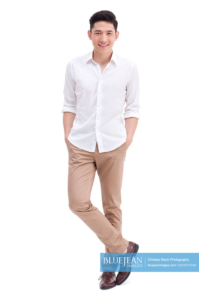 Handsome Chinese young man with hands in pockets