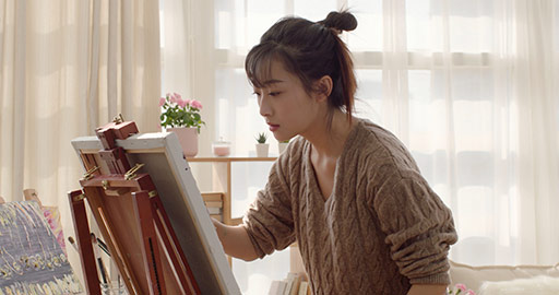 Young Chinese woman painting at home,4K