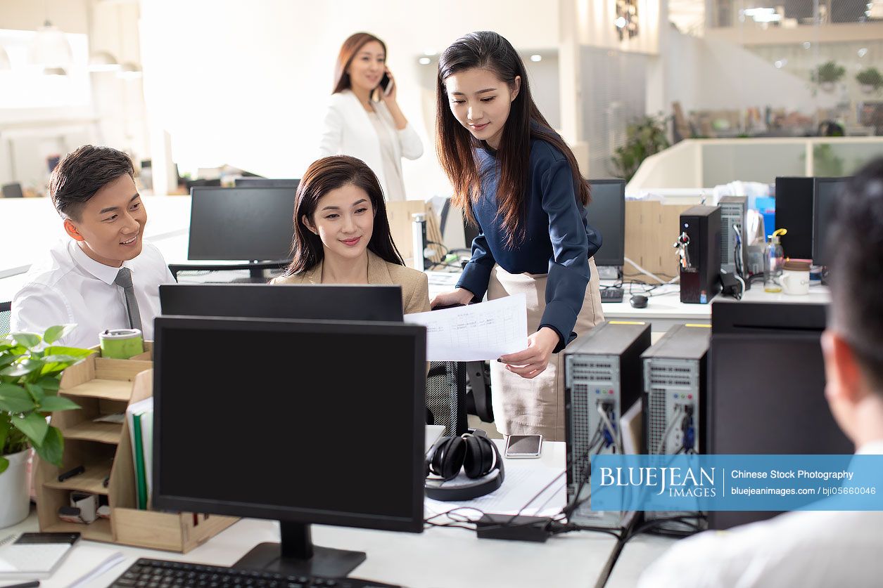 Chinese business people working in office