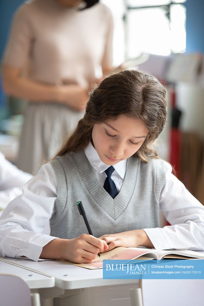 Little girl learning in classroom
