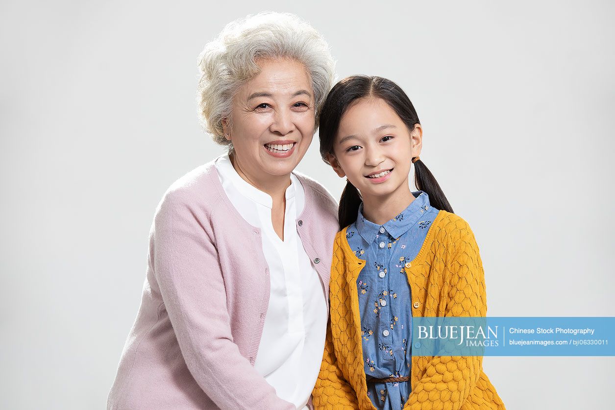 Happy Chinese grandmother and granddaughter