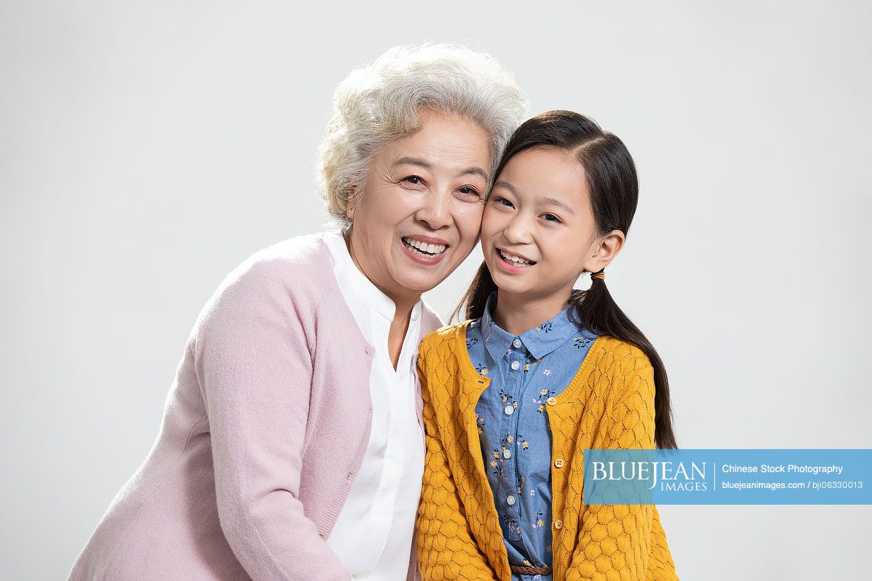 Happy Chinese grandmother and granddaughter