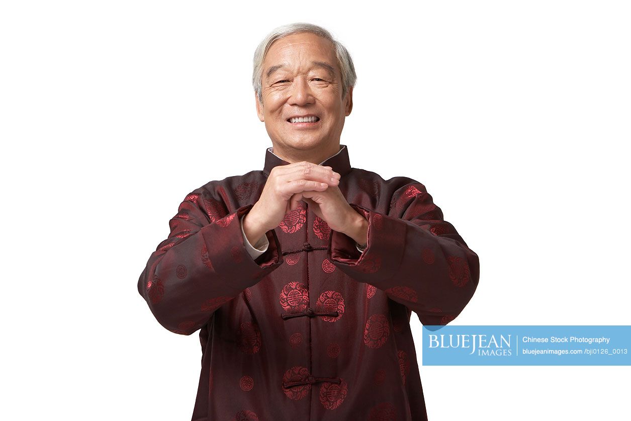 Senior Chinese gentleman greeting for Chinese New Year