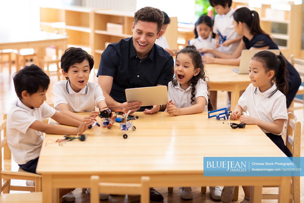 Children learning coding in classroom