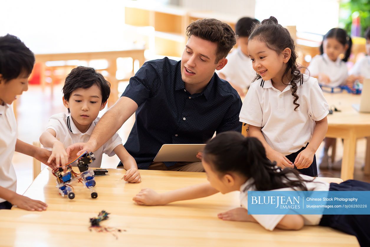 Children learning coding in classroom