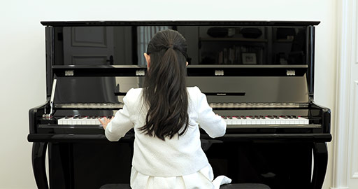 Little Chinese girl playing the piano,4K