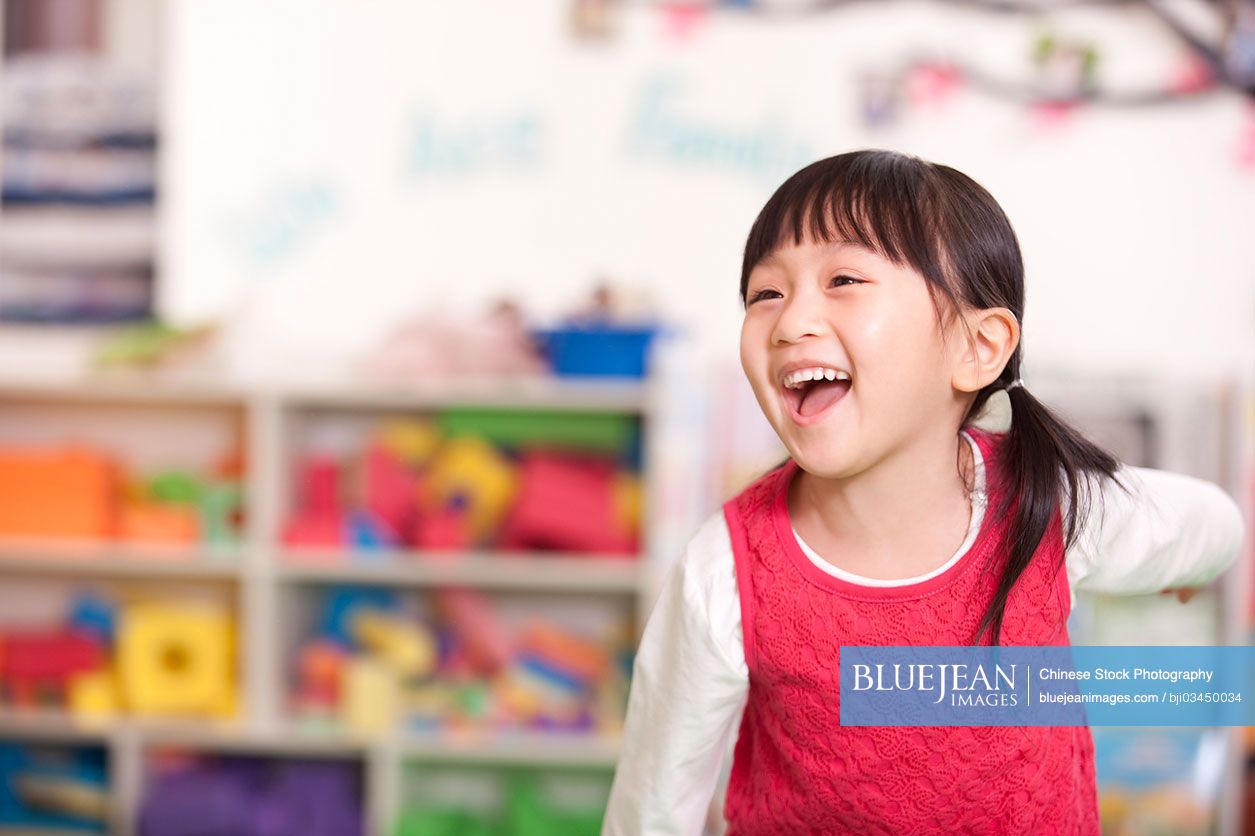 Cute little Chinese girl smiling