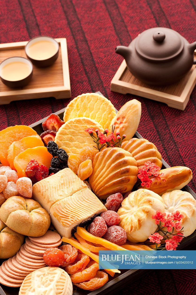 Chinese traditional dim sum and preserved fruits with tea