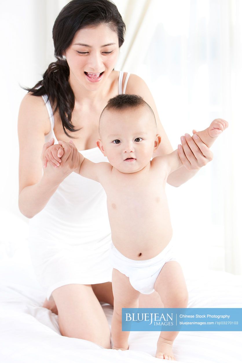 Chinese mother and cute baby boy at home