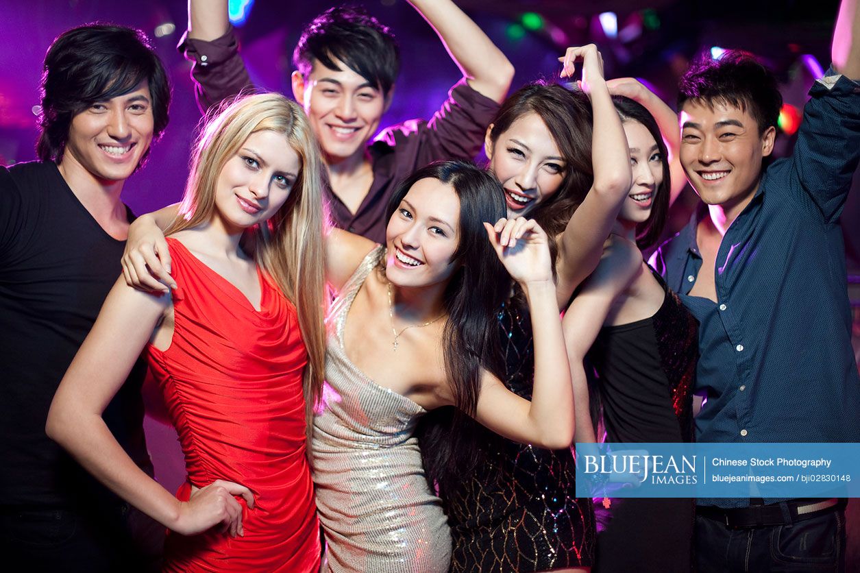 Stylish young Chinese in nightclub