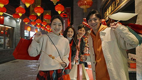 Young Chinese friends with candied haw celebrating Chinese New Year,4K