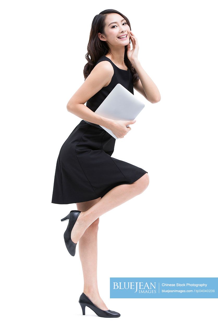Young Chinese businesswoman with digital tablet