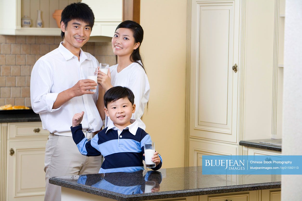 A Chinese family of three drinking milk