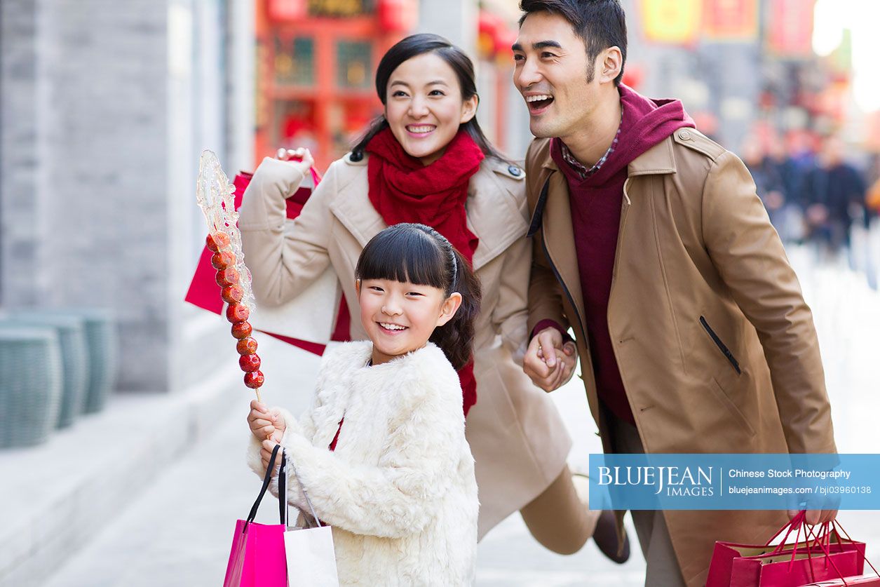 Happy Chinese family shopping for Chinese New Year