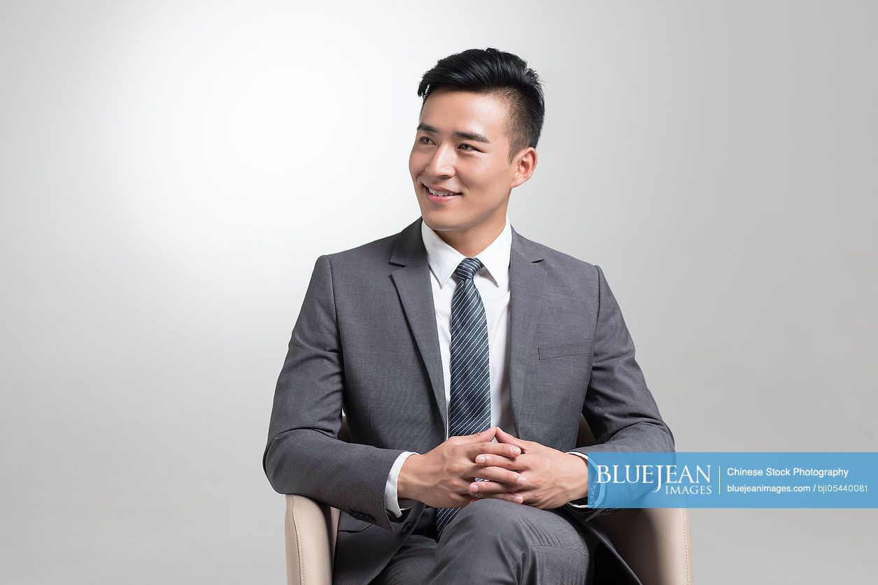 Cheerful young Chinese businessman